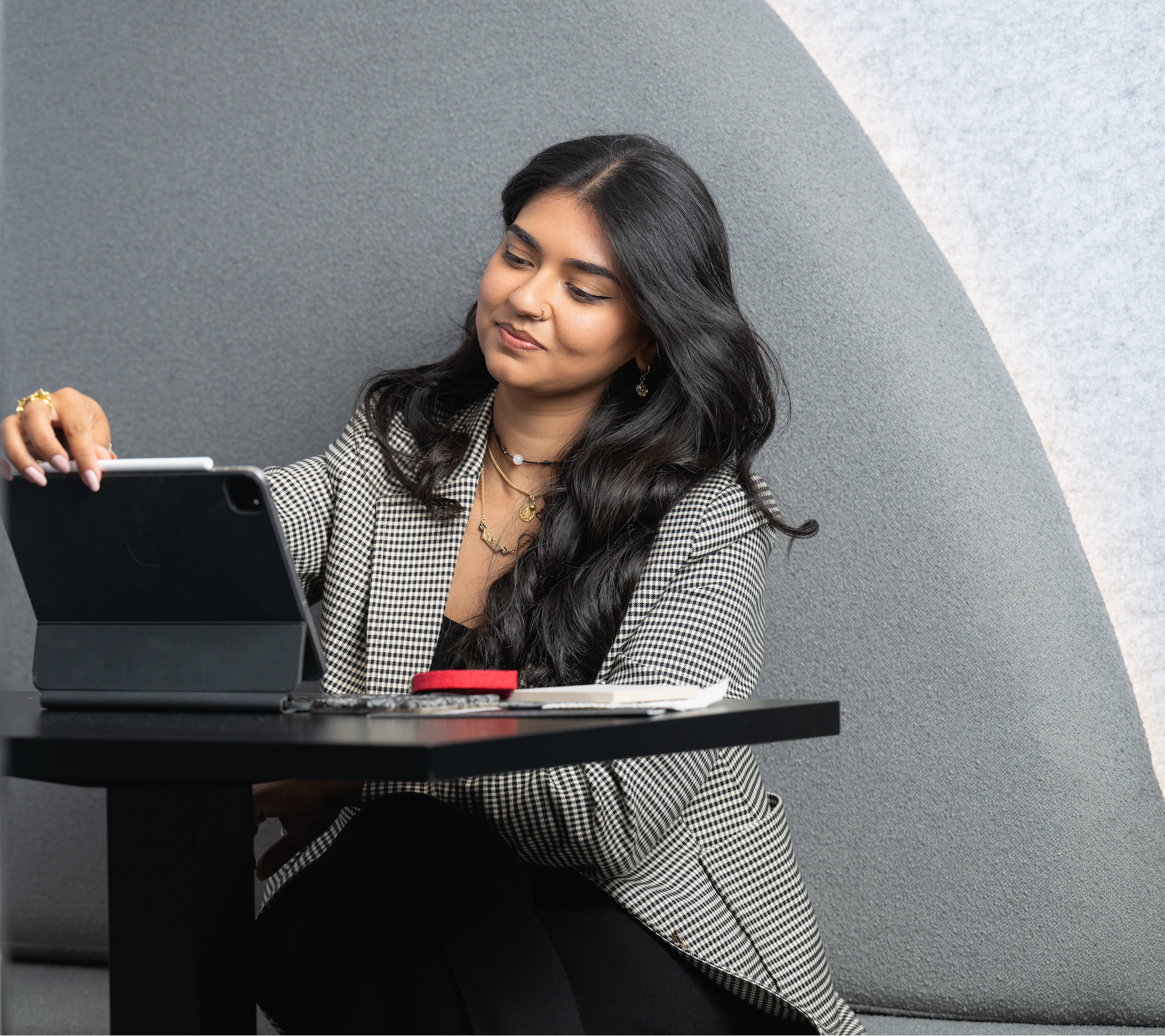 Commercial interior designer working on workspace concepts using digital design tools